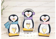 Penguin votive holders.