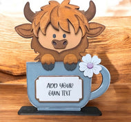 Highland cow in coffee cup