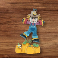 Scarecrow and pumpkins